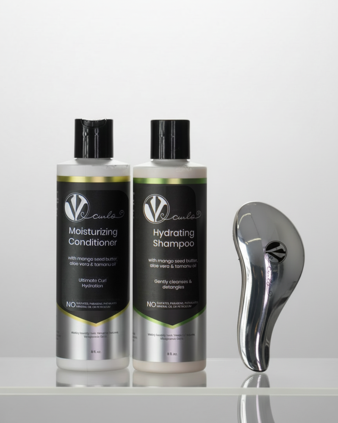 A bottle of hydrating shampoo and a bottle of moisturizing conditioner for wavy and curly hair and a hairbrush on a white background.
